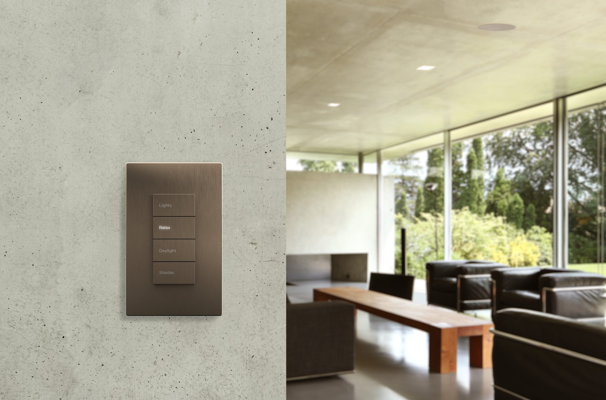 Bronze keypad mounted on a plaster wall, living room beyond